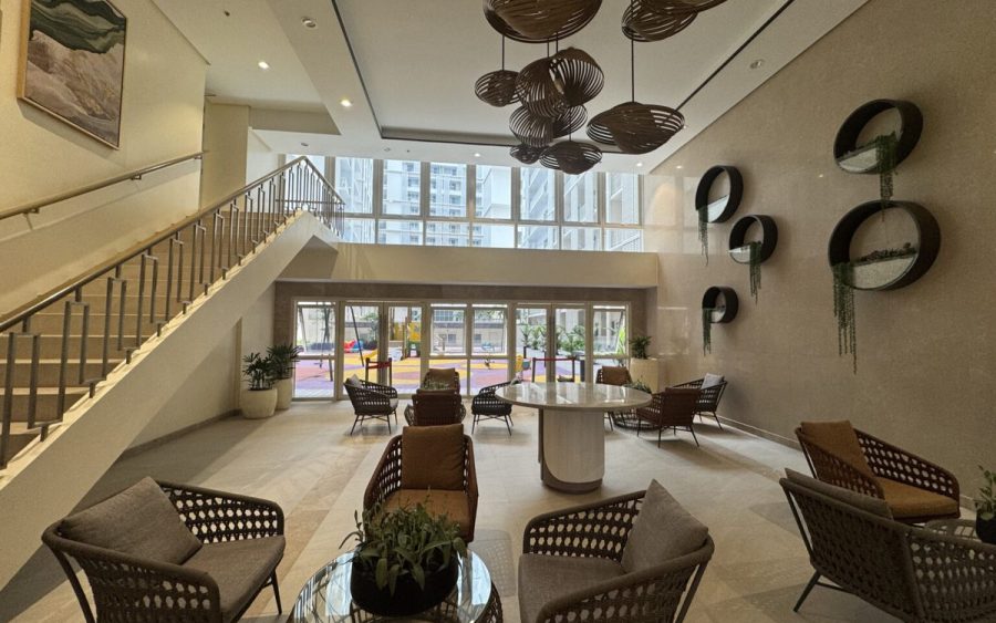 Condominium lobby with double-height ceiling and lounge seating