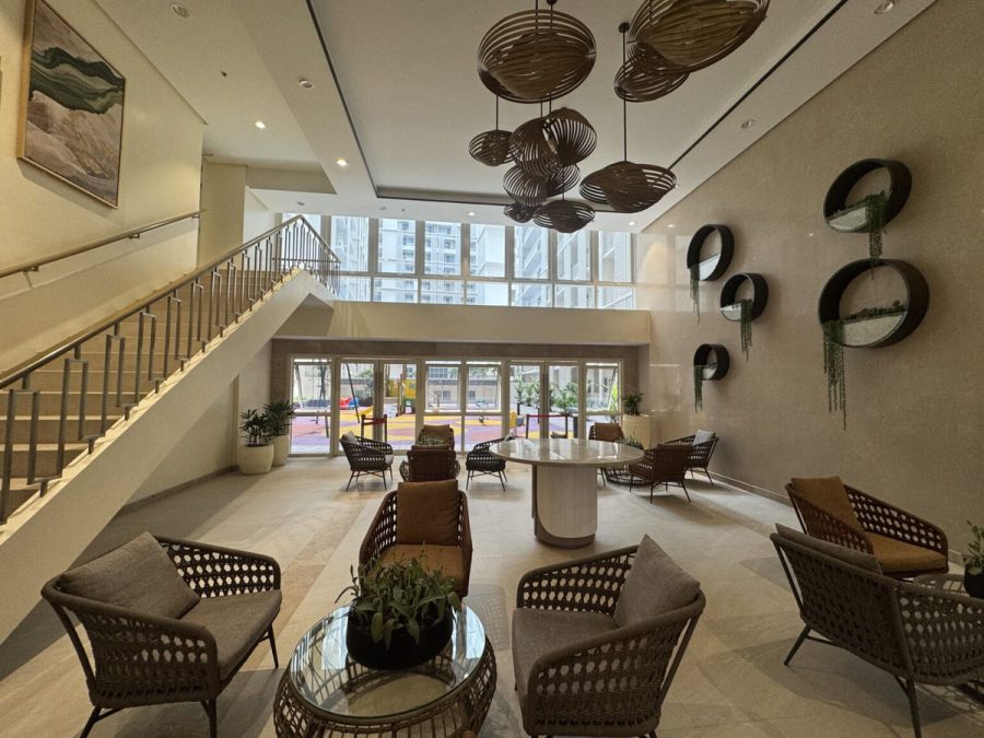 Condominium lobby with double-height ceiling and lounge seating