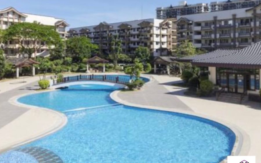 Landscaped swimming pool amenity in a low-rise condominium development