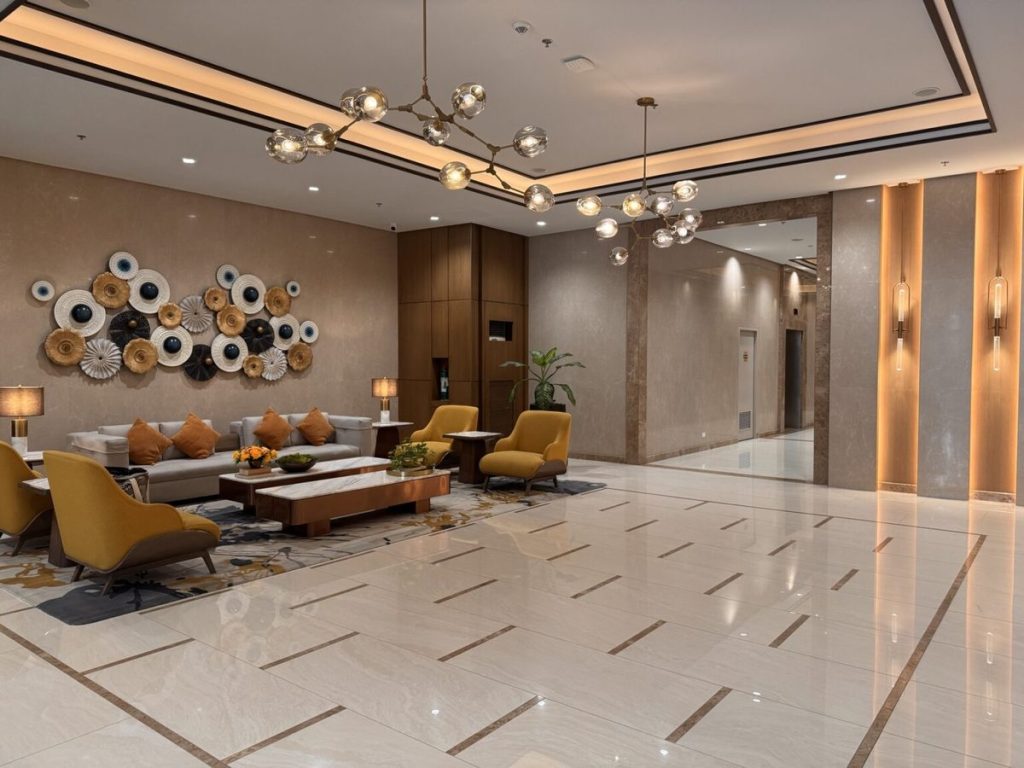 Premium ground-floor lobby with marble flooring and lounge seating