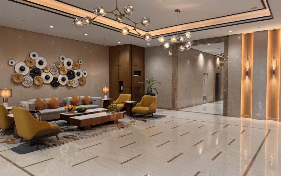Premium ground-floor lobby with marble flooring and lounge seating